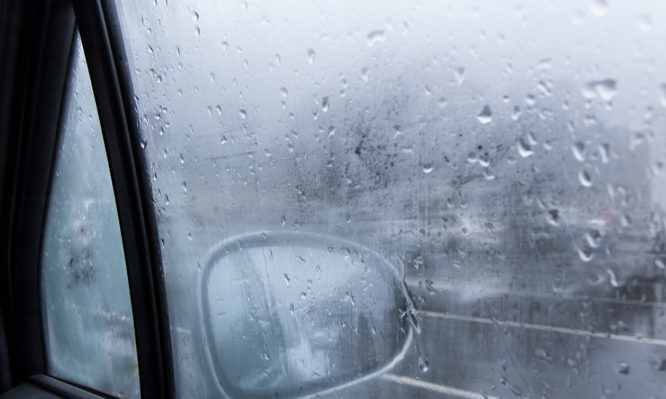 View of a car side mirror with condensation